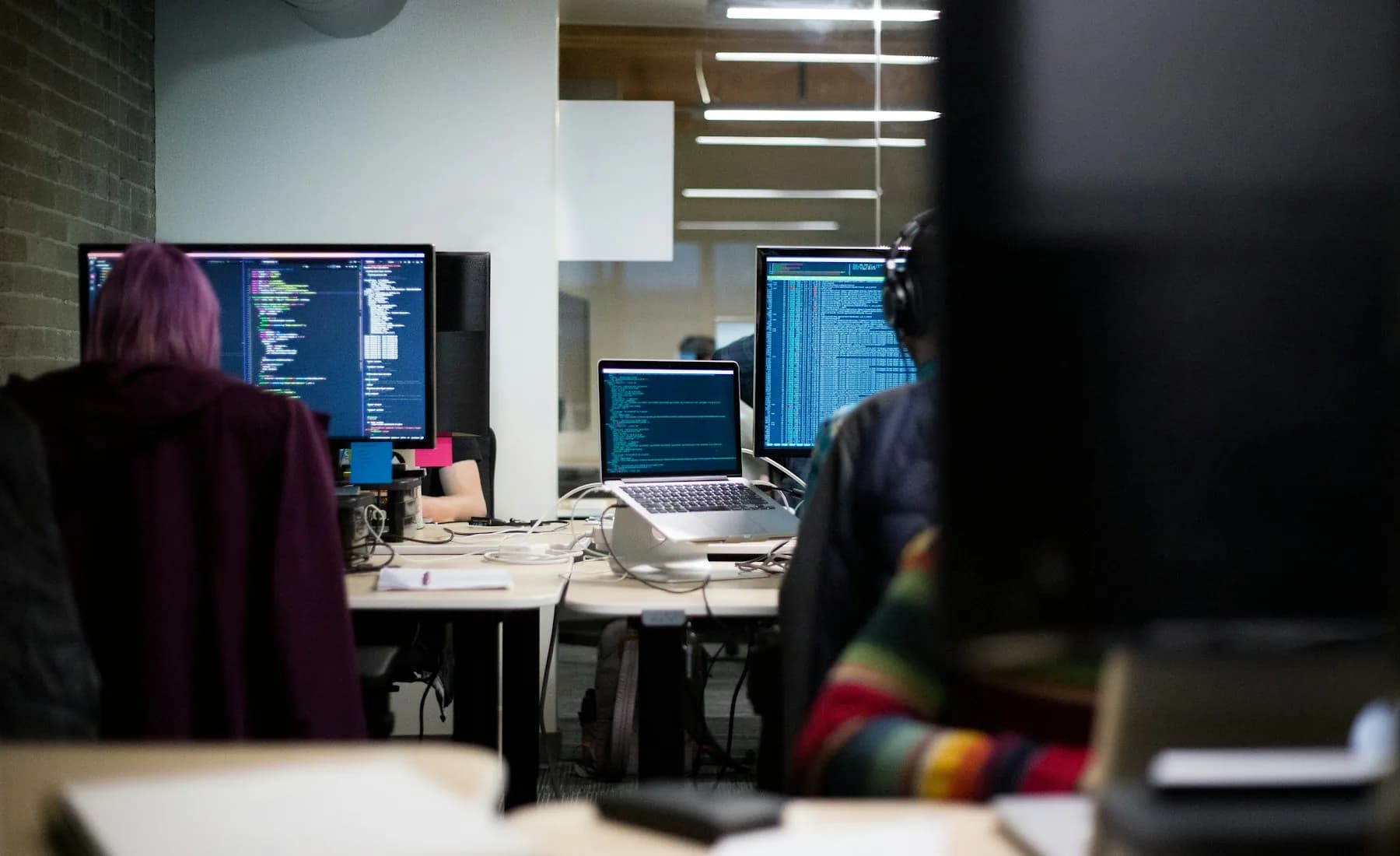 Workspace with software development screens